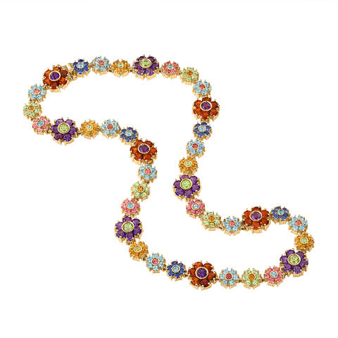 Round view of the Multi Gemstone Floral Necklace featuring an array of gemstones including amethyst, peridot, sapphire, garnet, and aquamarine. A whimsical and colorful twist on fine jewelry.