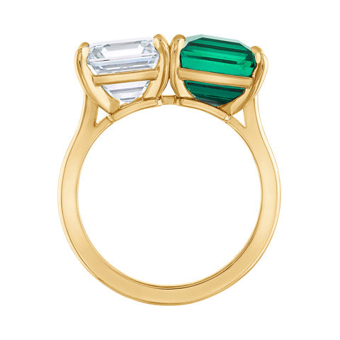Side view of the Emerald and Diamond Toi et Moi Ring, featuring a 3.5 carat Colombian emerald and a 3.5 carat D color VS1 diamond, elegantly set in 18 karat yellow gold.