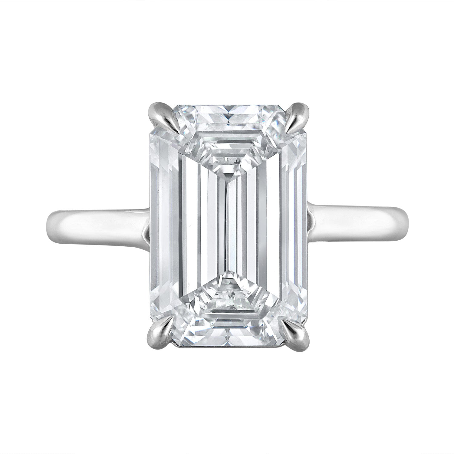 Front view of the Five Carat Emerald Cut Solitaire Diamond Ring featuring a 5.01 carat K color SI1 clarity diamond, set in a handmade platinum setting. Designed by Susan Kottemann.