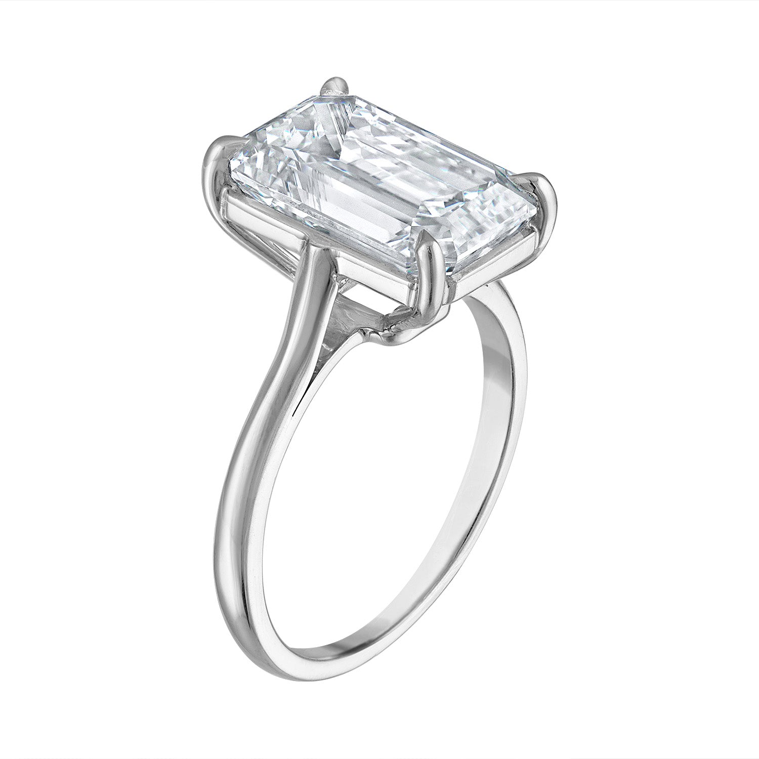 Three quarter view of the Five Carat Emerald Cut Solitaire Diamond Ring, showcasing a 5.01 carat K color SI1 clarity diamond in a handmade platinum setting. Designed by Susan Kottemann.