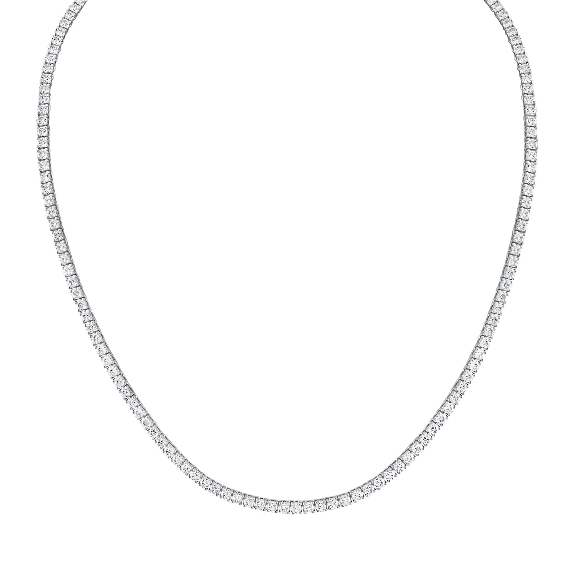 Elegant platinum Riviera necklace featuring 10 carats of natural diamonds with F-G color and VS1-VS2 clarity, set in a classic four-prong setting. Perfect for both stunning solo wear and for layering with other necklaces for a chic, everyday look.